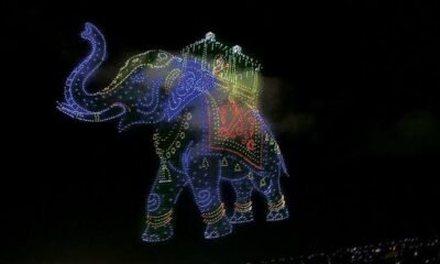 Mysuru Dasara drone show displaying Goddess Chamundeshwari and the golden ambari elephant in the night sky.