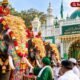 Decorated Mysuru Dasara elephants visiting a dargah as part of a traditional festival observance.