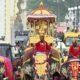 Golden howdah carrying Goddess Chamundeshwari during the Mysuru Dasara Jamboo Savari procession with decorated elephants and cultural tableaux.