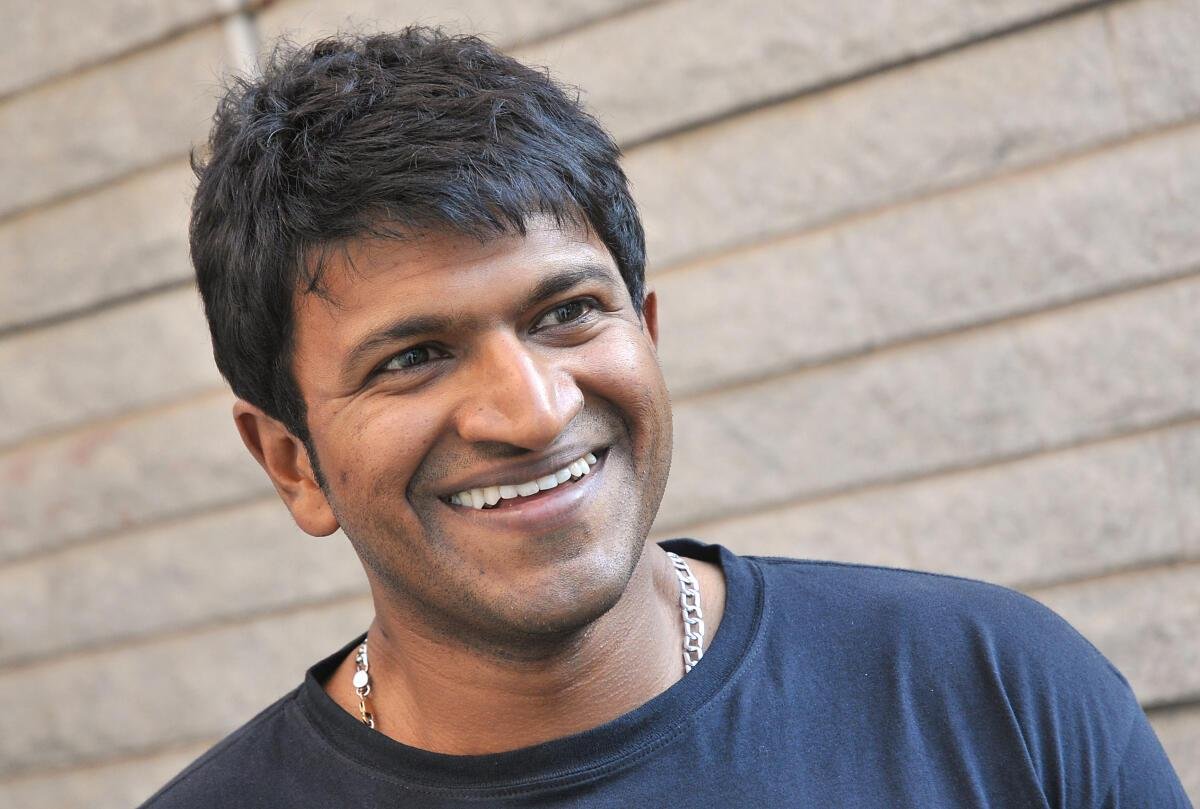 Puneeth Rajkumar smiling portrait for his fifth death anniversary tribute.