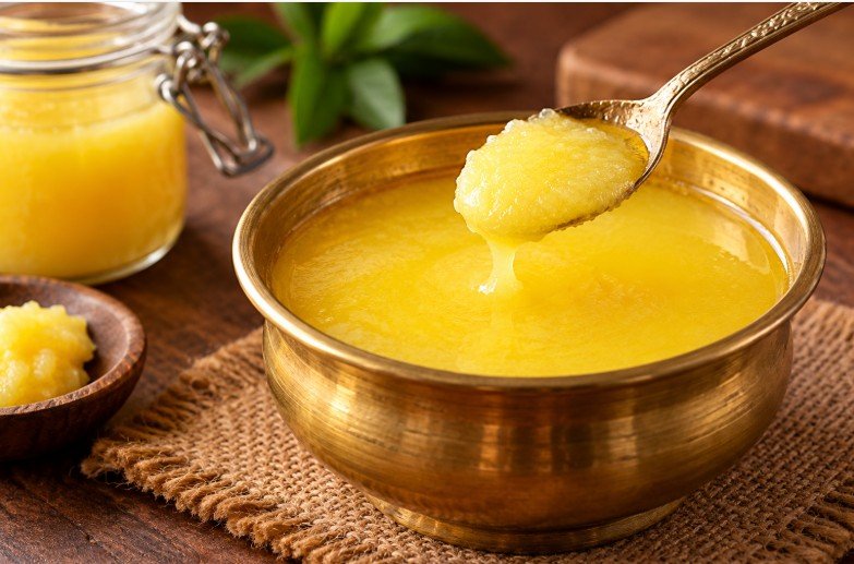 Traditional Indian ghee in a bowl with a spoon