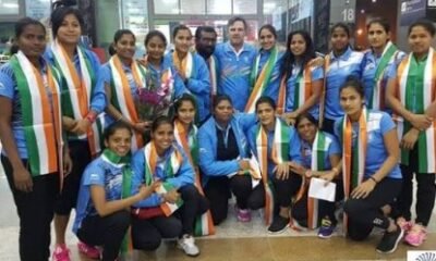 Indian women's hockey team receiving a grand welcome at Kempegowda International Airport Bengaluru after Asian Games 2026 gold